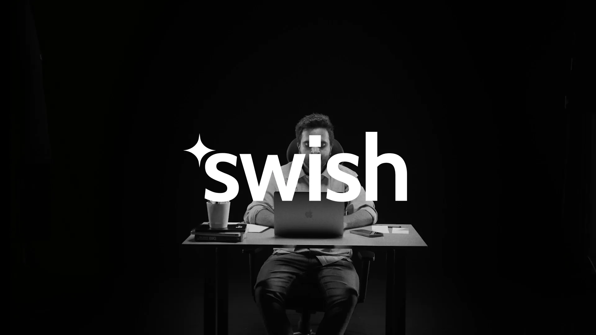 the swish logo over a dark shot from the ad